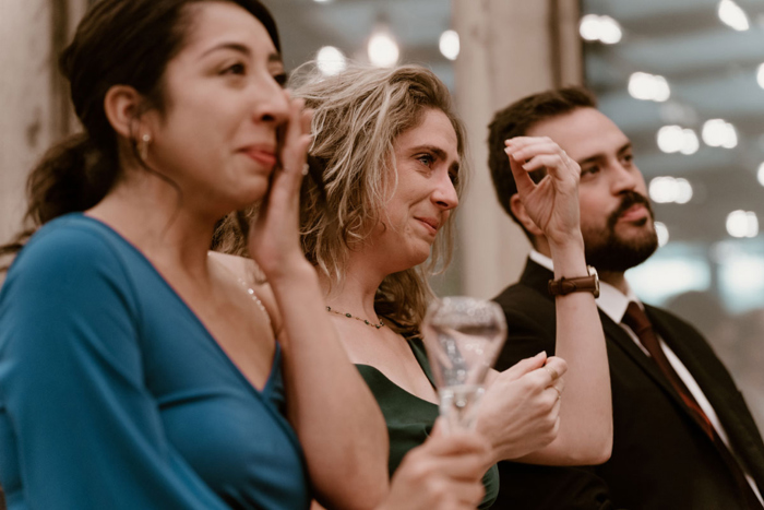 Guests look emotional at the ceremony