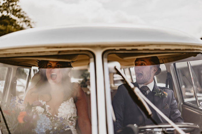 Couple look excited in the VW Campervan