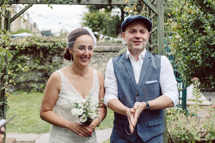 Bride And Groom during outdoor garden Ceremony