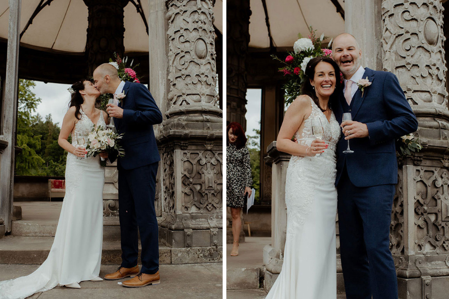 Bride and groom share a kiss and smile for the camera during their ceremony