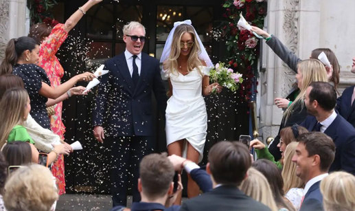 Jamie Laing and Sophie Habboo exit the registry office after getting married to guests throwing confetti