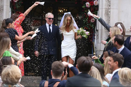 Jamie Laing and Sophie Habboo exit the registry office after getting married to guests throwing confetti