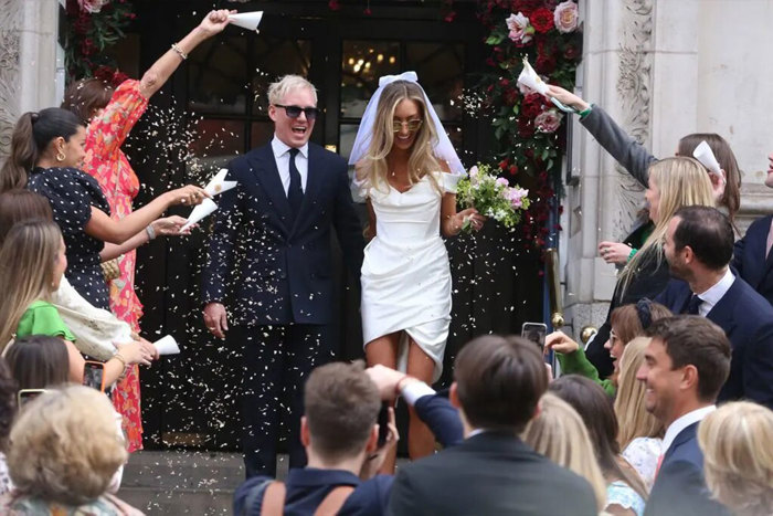 Jamie Laing and Sophie Habboo exit the registry office after getting married to guests throwing confetti