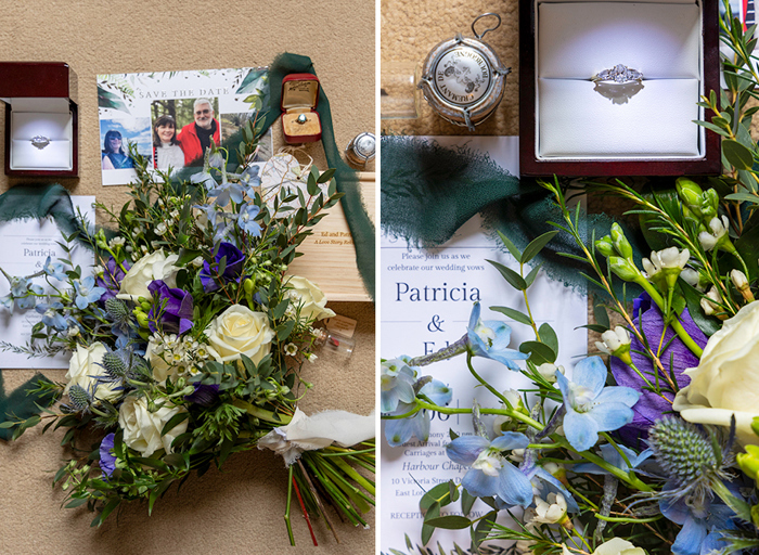 a flat lay of a bouquet of flowers, wedding invite and rings 