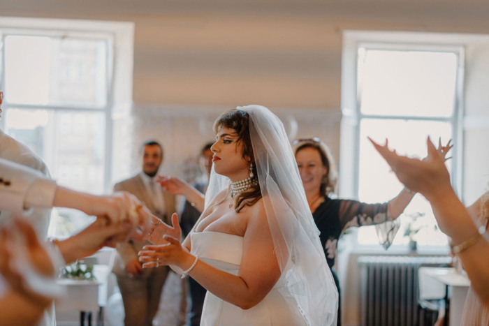 Bride dancing with guests at wedding reception at Garnethill Multicultural Centre Wedding