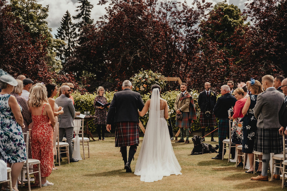 Bride and father walk down the aisle