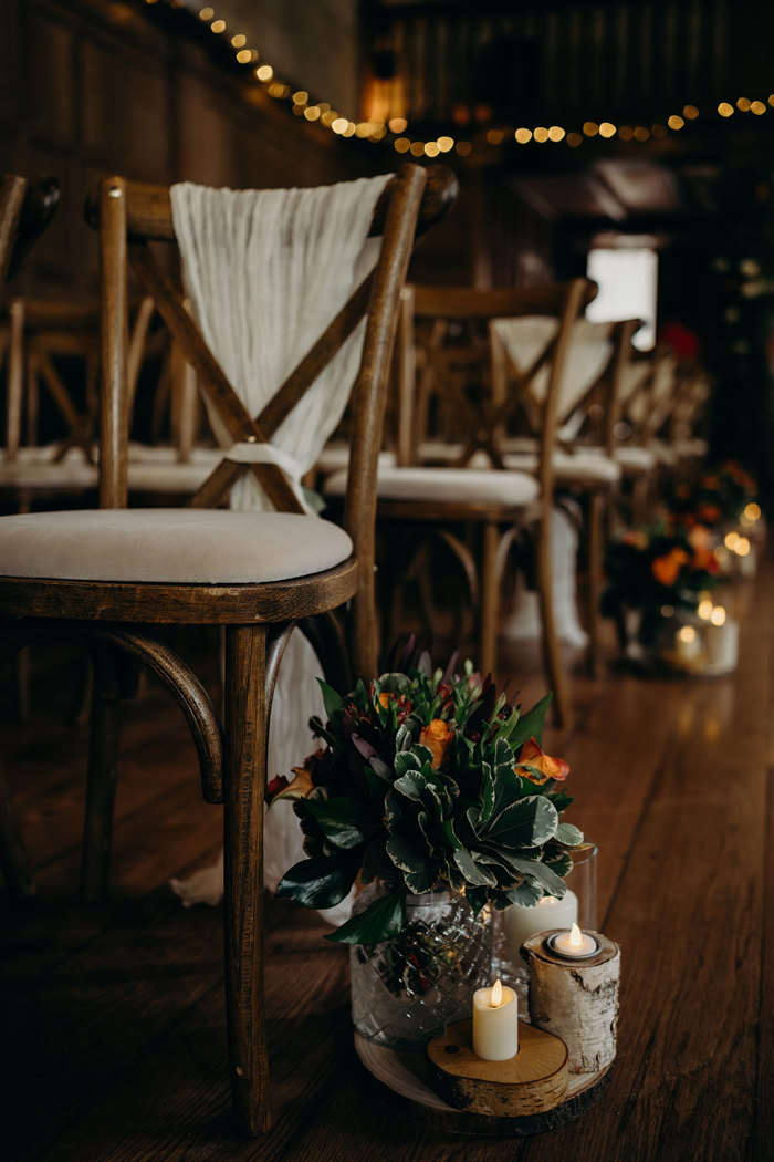 a wooden chair with flower decoration on the floor