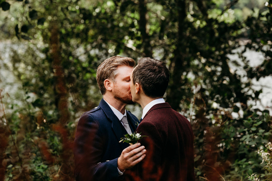 Two grooms share a kiss