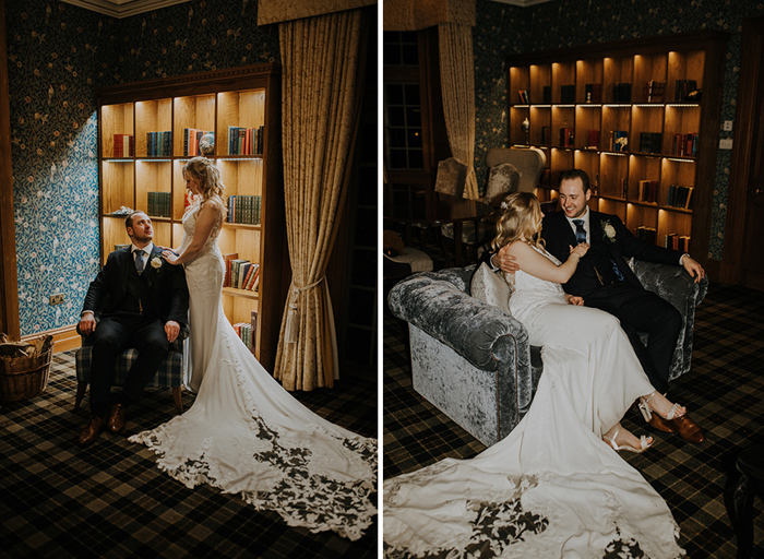 on the left a groom in a suit sits in an armchair as a bride stands next to him in front of a bookshelf, on the right the couple both sit in a grey velvet couch