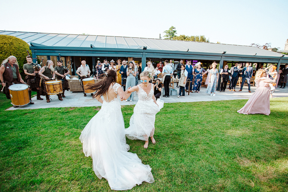 Brides dance outside