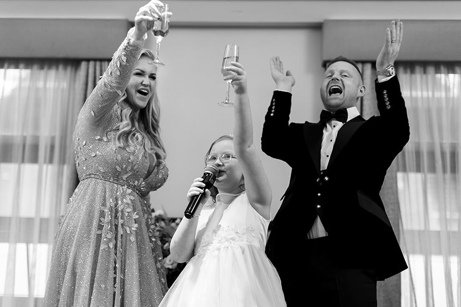 three people raising a toast