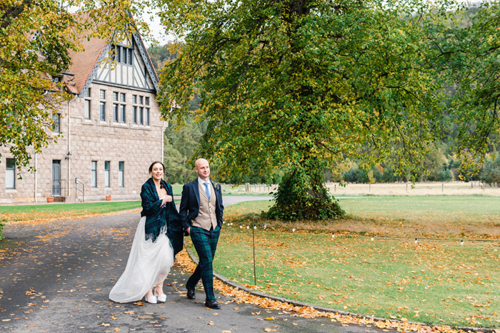 Bride and groom out a walk on their wedding day