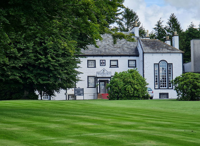 exterior of Gretna Hall Hotel with grass