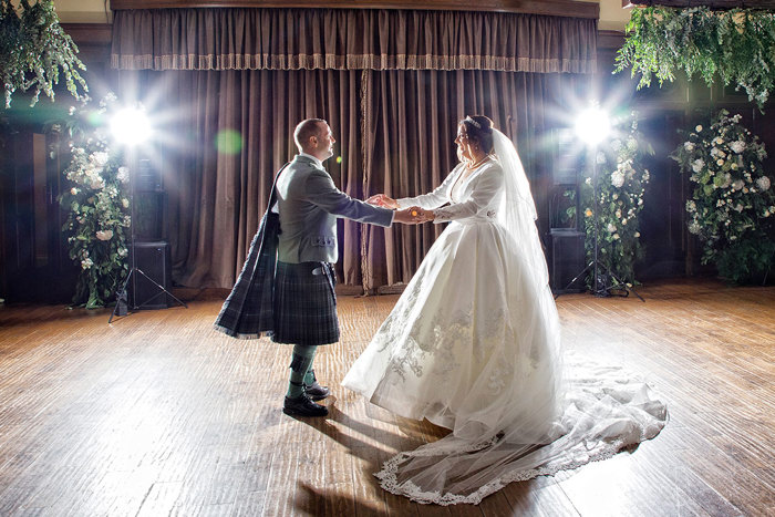 a bride and groom dancing 