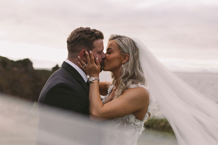 Bride and groom share a kiss