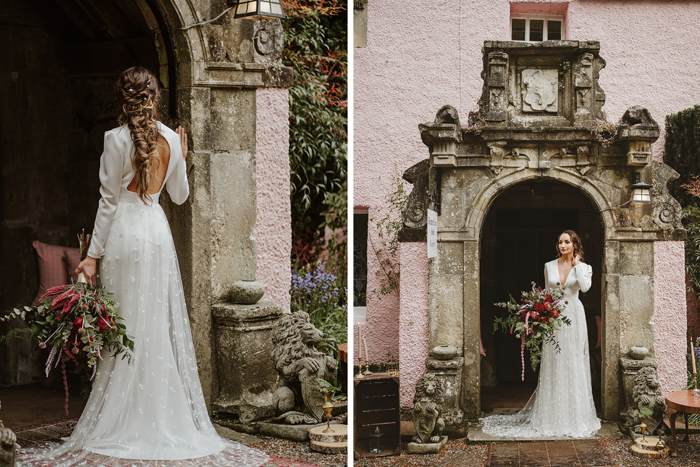 Bride holds pink and red bouquet outside of Roman Camp Hotel