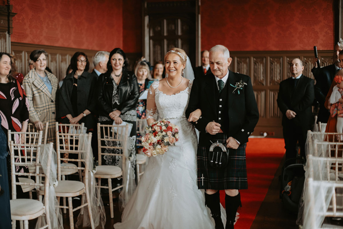 Bride's father walks her down the aisle