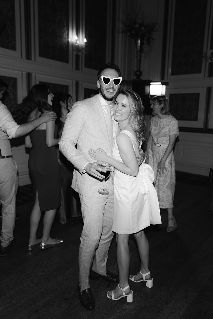 black and white picture of bride and groom during wedding reception at drumtochty castle