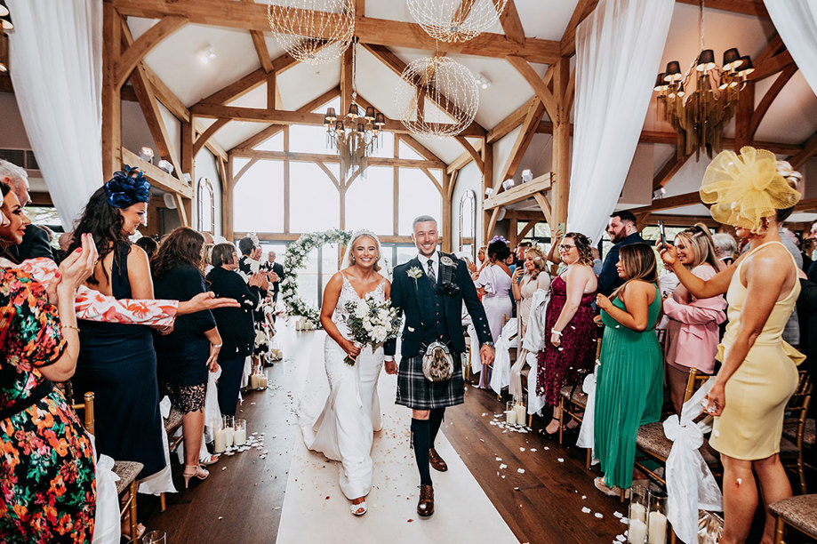 Bride And Groom Walking Up Aisle At Enterkine House