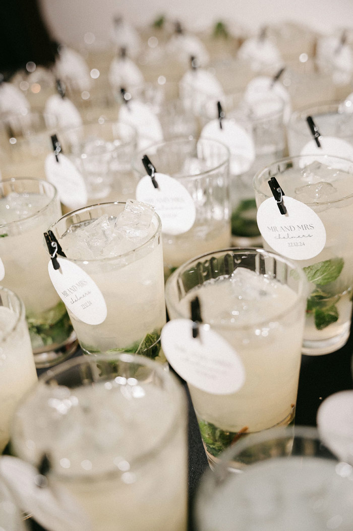 rows of the same mint based cocktail sit in line with the same little black clip and round paper card attached to the top