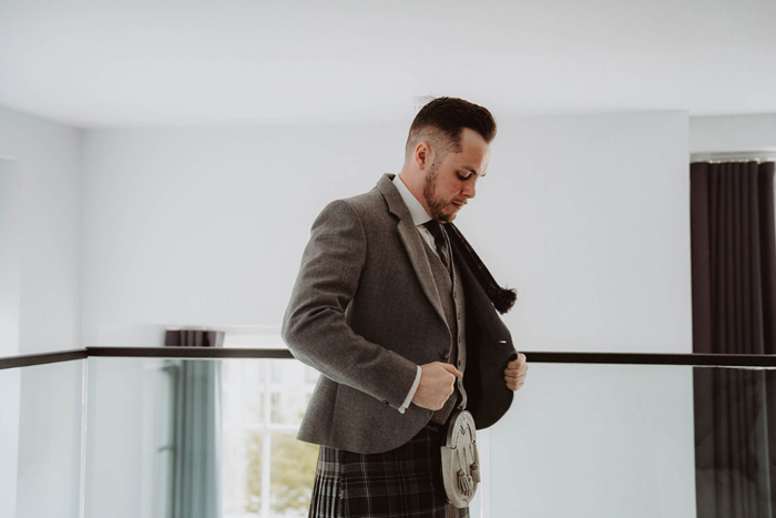 Groom gets ready on wedding morning