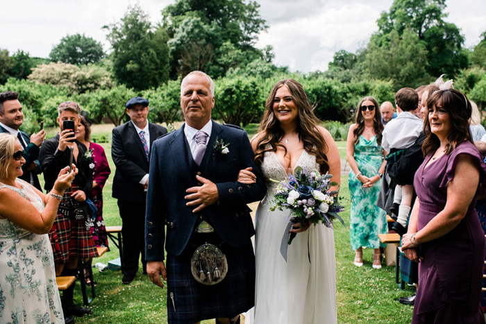 Bride walking down the aisle with her dad