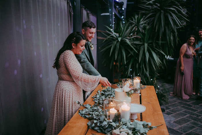 Bride And Groom Cutting Wedding Cake At Barras Art And Design