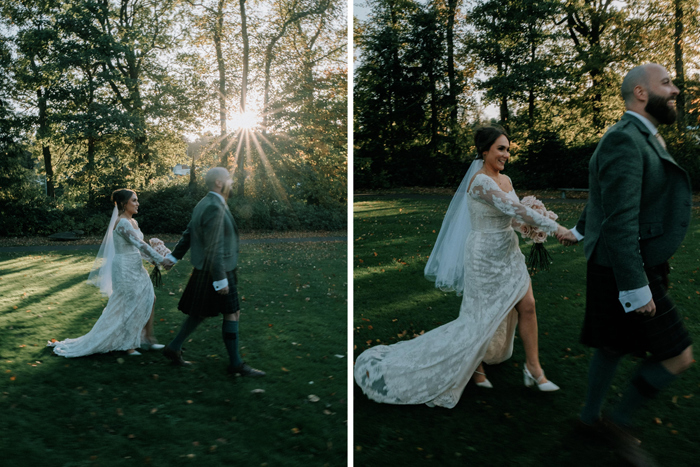 Bride and groom walk across lawn 