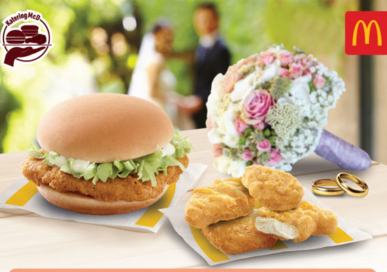 Image showing burger and chicken nuggets from McDonald's alongside a bridal bouquet and wedding rings