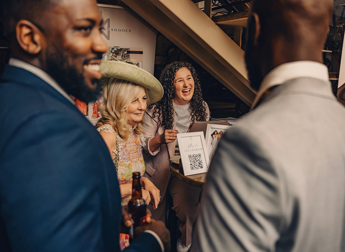 guests smiling and chatting 