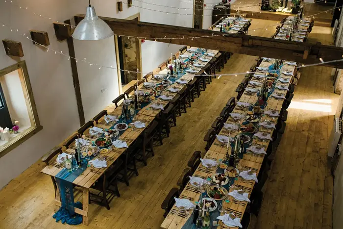 long tables inside a barn