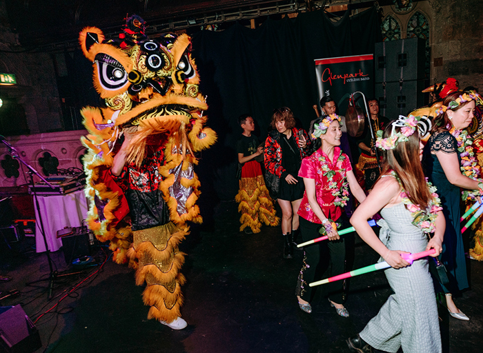 people taking part in a Chinese lion or dragon dance