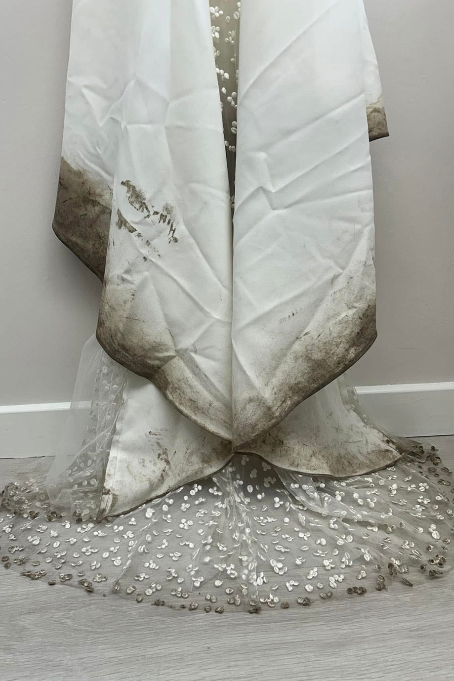 wedding dress with stains at bottom