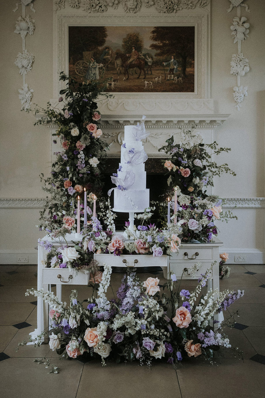 wedding cake on top of desk with floral arrangement Chatelherault shoot