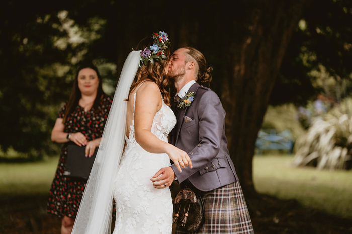 Bride and groom kiss at the end of their ceremony