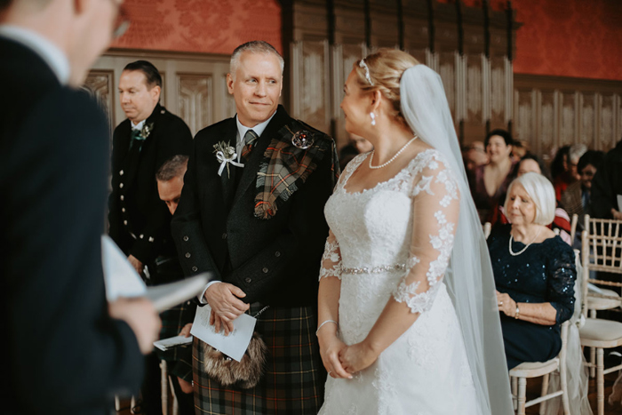 Bride and groom share a look during their ceremony