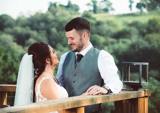 Bride and groom look at each other during couple portraits 