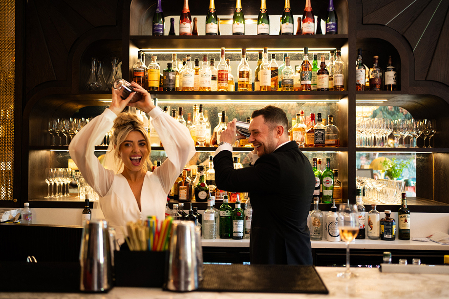 Bride And Groom Shaking Cocktails