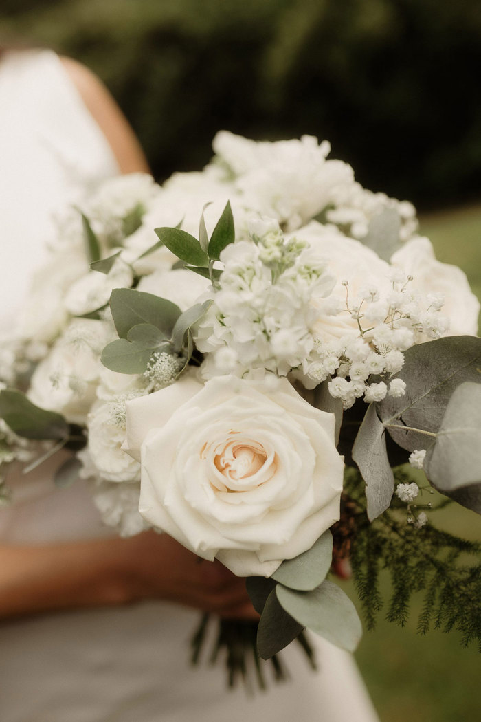 bride's bouquet of white flowers and green foliage