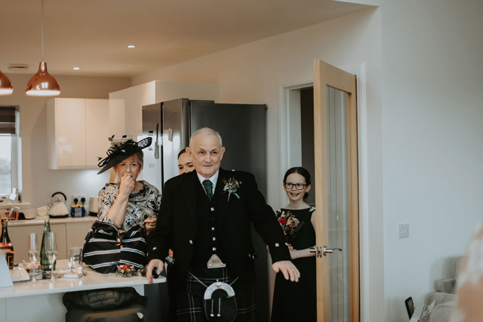 Bride's family react to seeing her in her wedding dress for first time