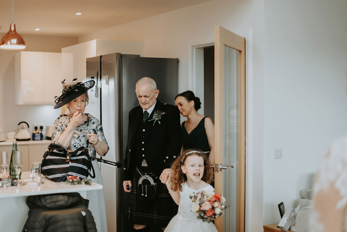 Flower girl reacts to first look with bride