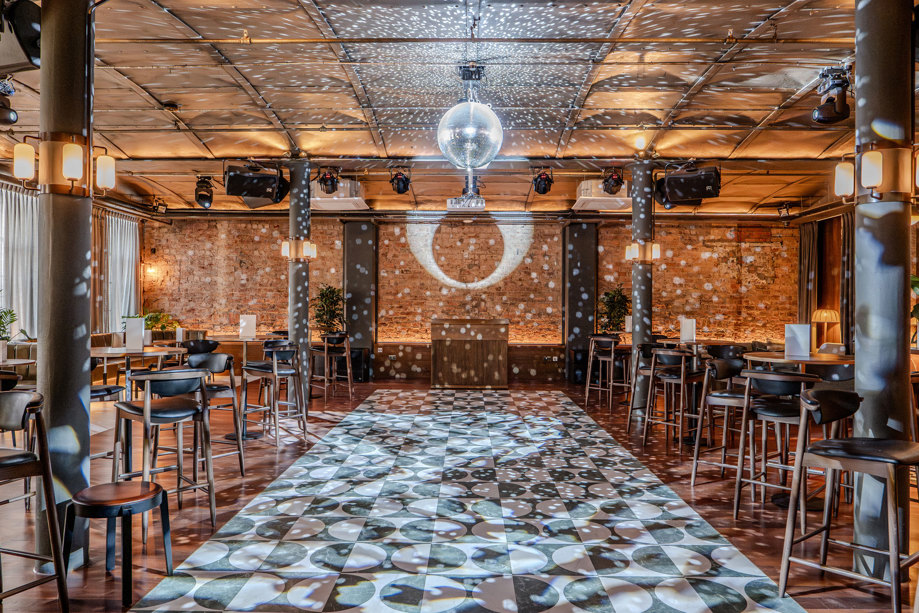 interior shot of the exchange's print room with disco ball and checkered effect dancefloor