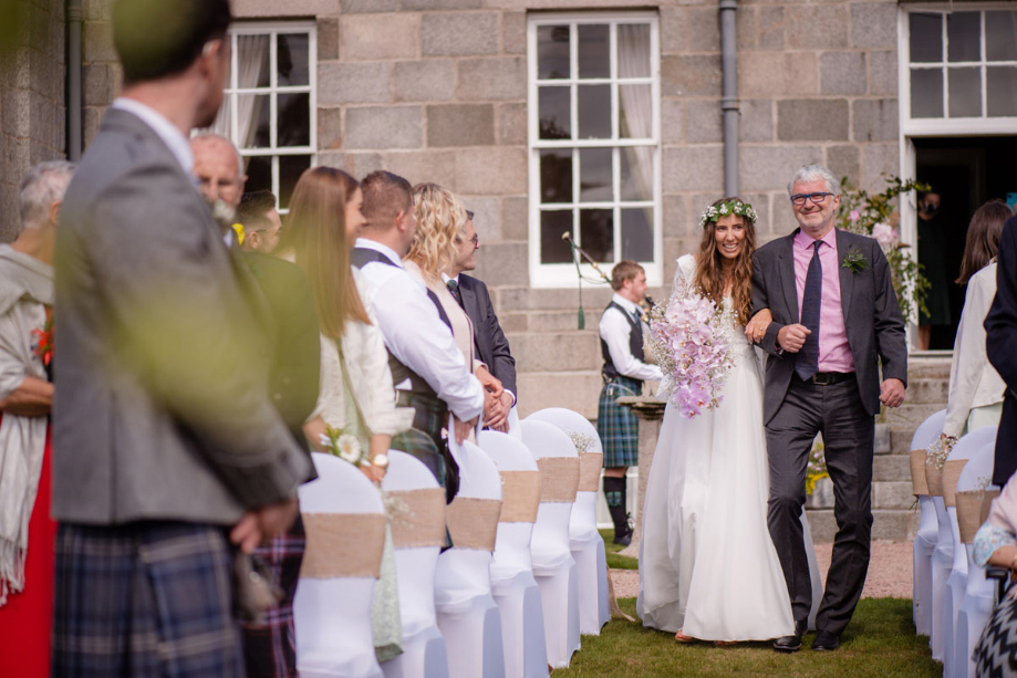 A Bride Walking Down Aisle At Outdoor Wedding Ceremony At Raemoir House