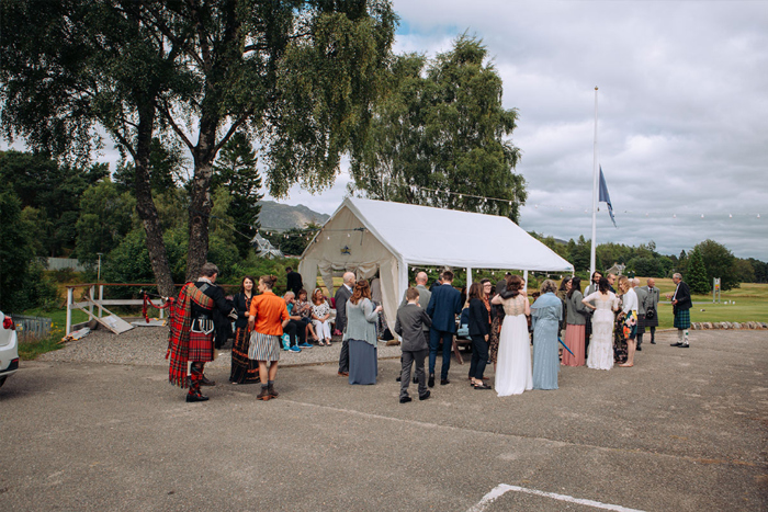 Wedding Guests Gathered Outside A Marquee At Newtonmore Golf Club