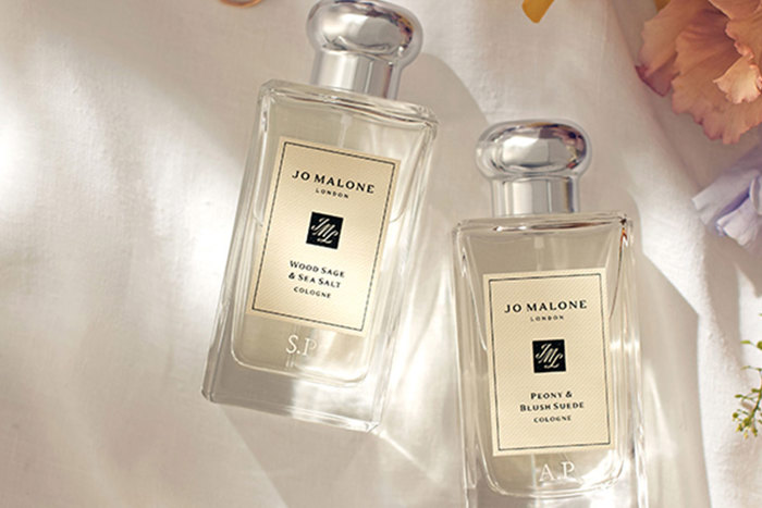 Two Jo Malone perfume bottles with initials