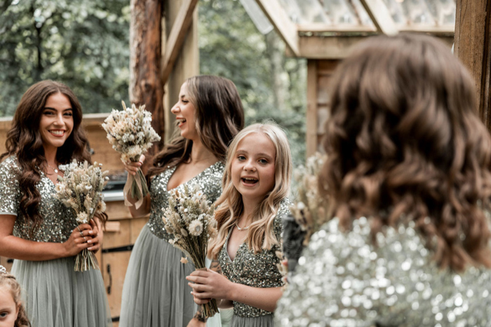 Bridesmaids laugh candidly 