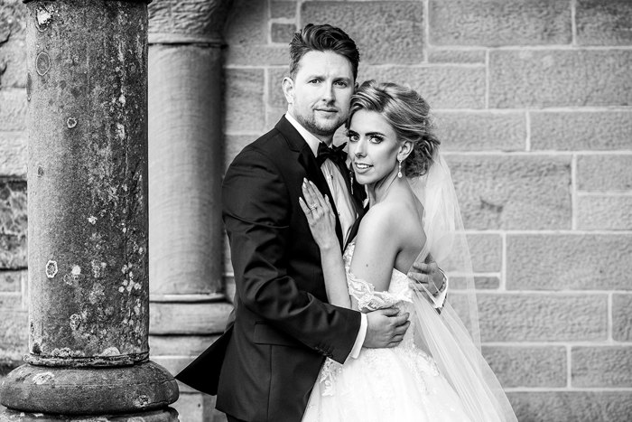 A Black And White Image Of A Bride And Groom