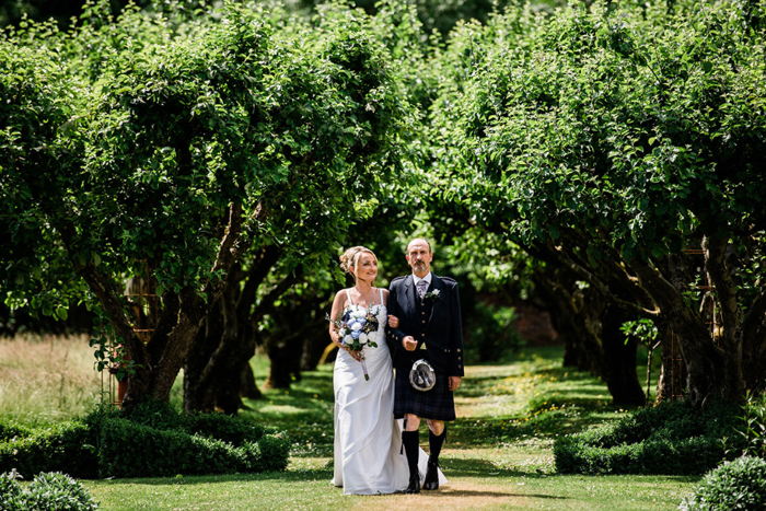 Bride walking down the aisle with her dad