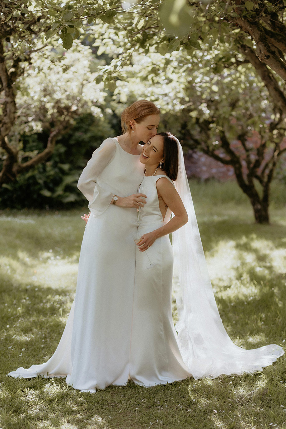 two joyous brides in the garden at the Byre at Inchrya