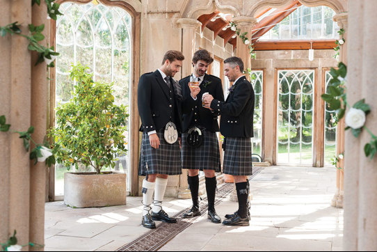 Three guys looking dapper in MacGregor and MacDuff kilts